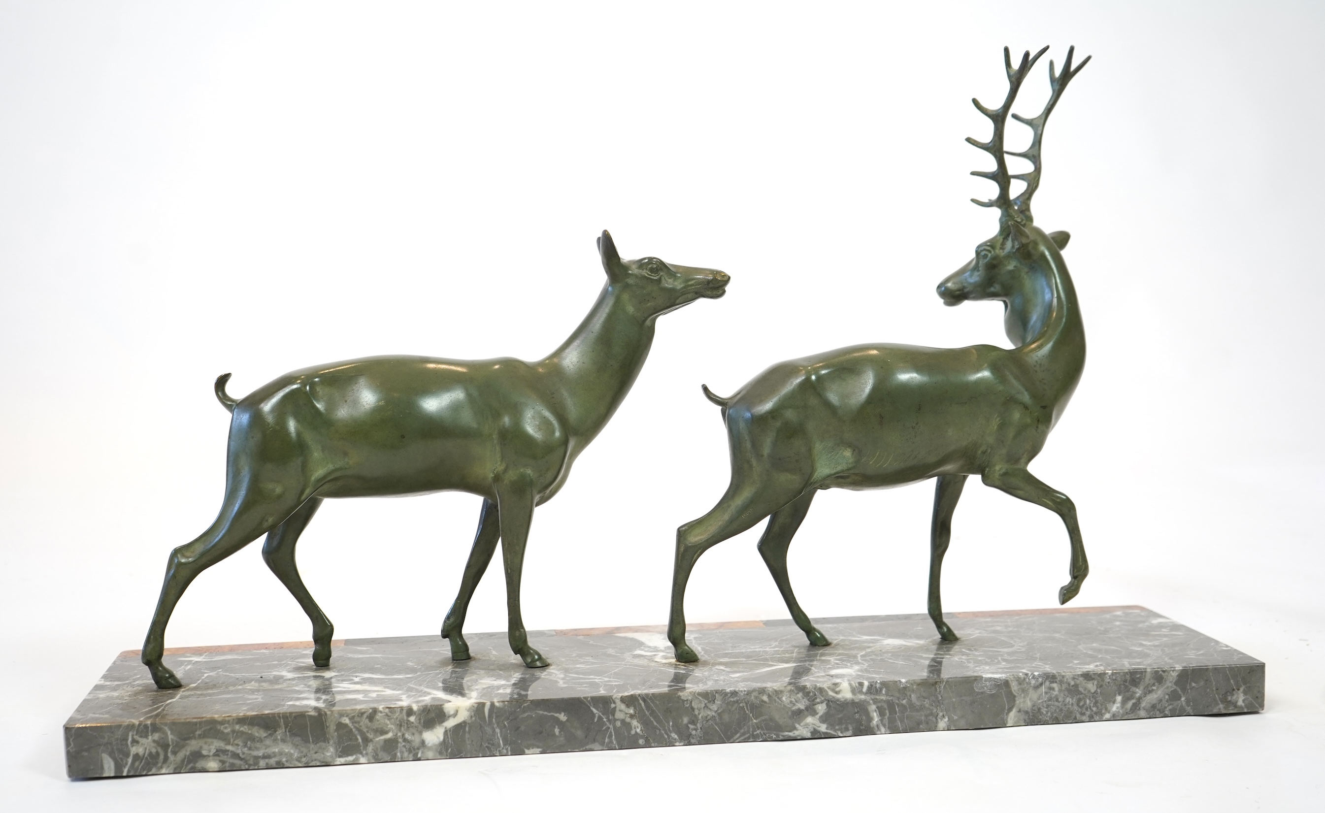 Manner of Louis-Albert Carvin, French 1875-1951, An Art Deco bronze group of a stag and doe